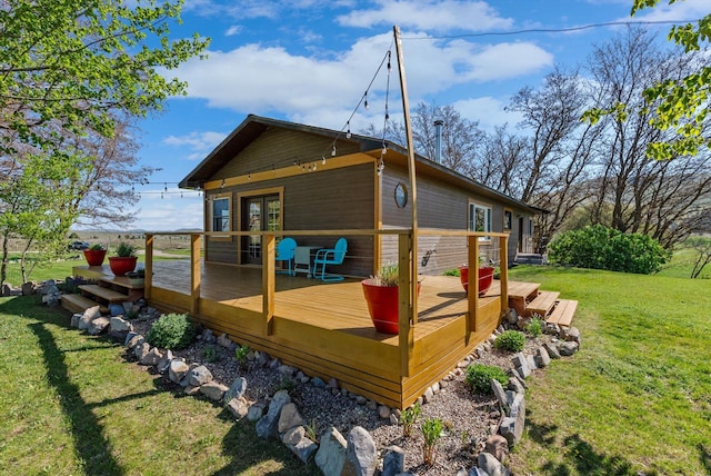 51943 Kuntz Ln, Charlo, MT 59824 - back of house with a yard, a deck, and french doors