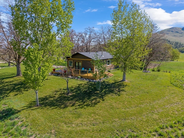 51943 Kuntz Ln, Charlo, MT 59824 - view of green lawn featuring french doors and a mountain view