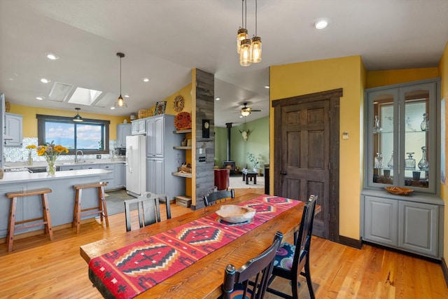 51943 Kuntz Ln, Charlo, MT 59824 - dining space featuring light wood-style floors, a ceiling fan, and a skylight