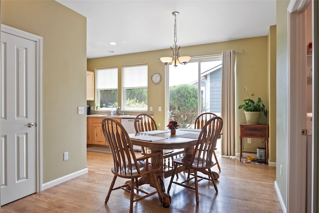 5015 Pius Way, Missoula, MT 59808 - dining space with healthy amount of natural light, a chandelier, light wood finished floors, recessed lighting, and baseboards