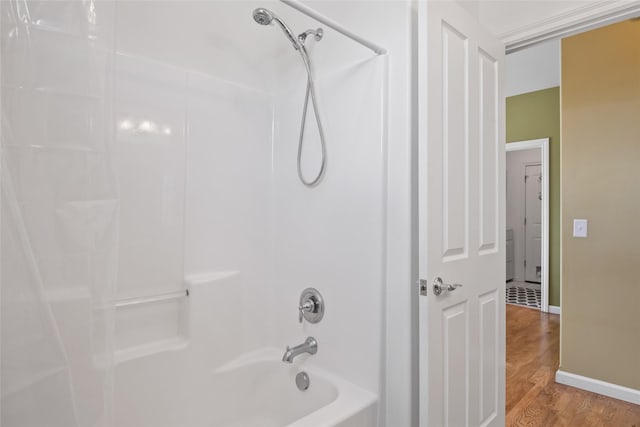 5015 Pius Way, Missoula, MT 59808 - bathroom with shower / washtub combination, wood finished floors, and baseboards