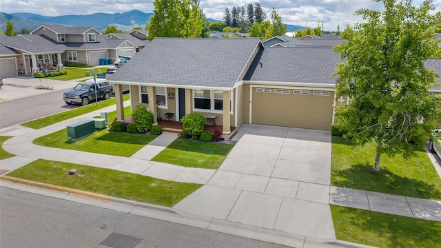 5015 Pius Way, Missoula, MT 59808 - townhome / multi-family property featuring a porch, a garage, driveway, a residential view, and a front yard