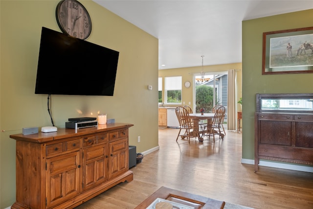 5015 Pius Way, Missoula, MT 59808 - living area featuring light wood-style flooring, a chandelier, and baseboards