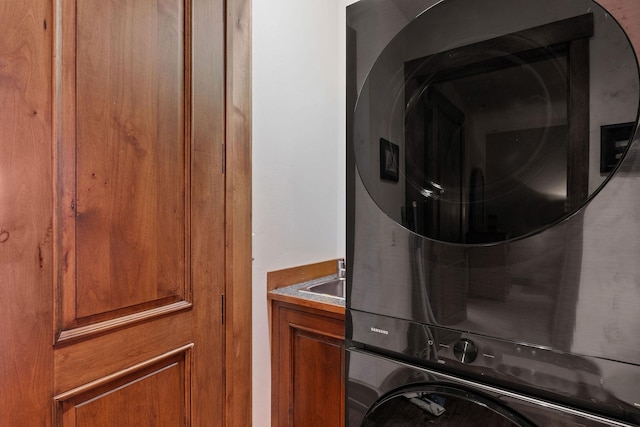 5675 US Highway 93 S Unit 10, Somers, MT 59932 - washroom with cabinet space and stacked washer / dryer
