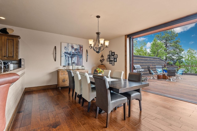 5675 US Highway 93 S Unit 10, Somers, MT 59932 - dining room with a chandelier, hardwood / wood-style floors, baseboards, plenty of natural light, and expansive windows