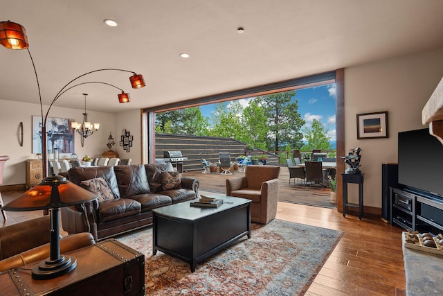 5675 US Highway 93 S Unit 10, Somers, MT 59932 - living area featuring a chandelier, wood-type flooring, baseboards, and recessed lighting