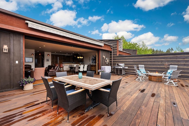 5675 US Highway 93 S Unit 10, Somers, MT 59932 - wooden deck with a fire pit and outdoor dining area
