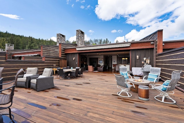5675 US Highway 93 S Unit 10, Somers, MT 59932 - deck with a fire pit and outdoor dining space