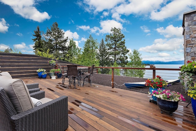 5675 US Highway 93 S Unit 10, Somers, MT 59932 - wooden deck featuring outdoor dining area and a water view
