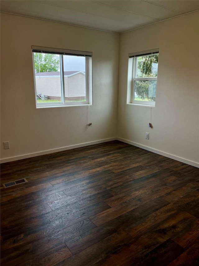 467 Grantsdale Rd Unit 16, Hamilton, MT 59840 - spare room with plenty of natural light, dark wood finished floors, and baseboards