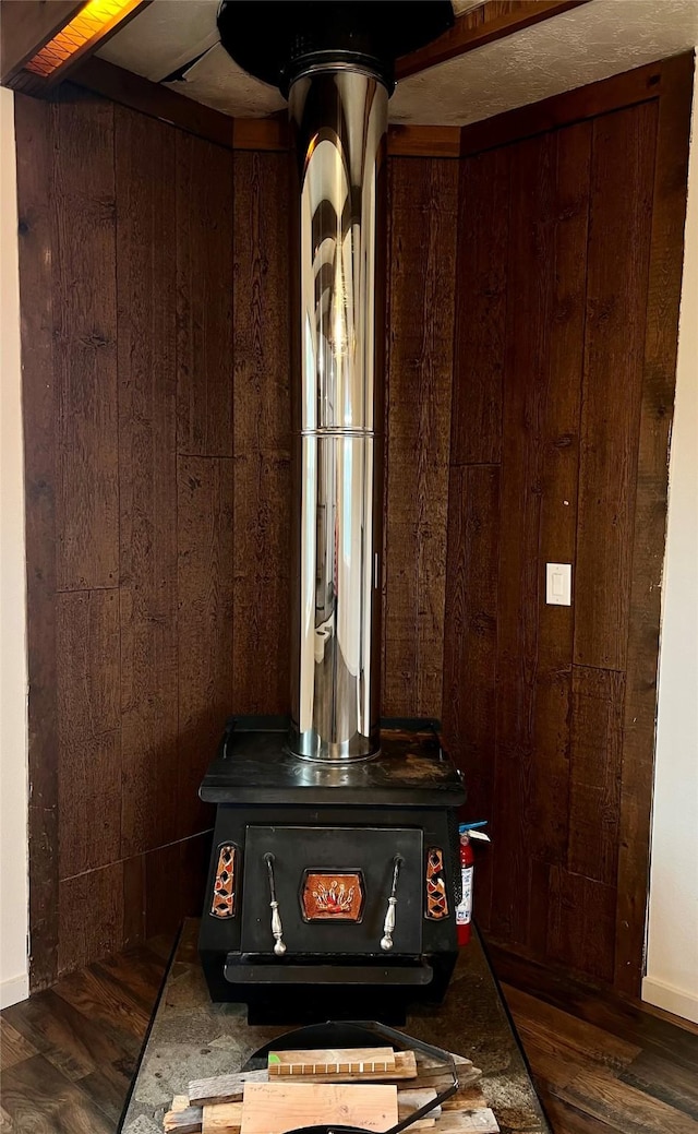 467 Grantsdale Rd Unit 16, Hamilton, MT 59840 - detailed view of a wood stove, wood walls, and wood finished floors
