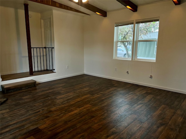 467 Grantsdale Rd Unit 16, Hamilton, MT 59840 - unfurnished room with beam ceiling, dark wood-style flooring, baseboards, and a ceiling fan