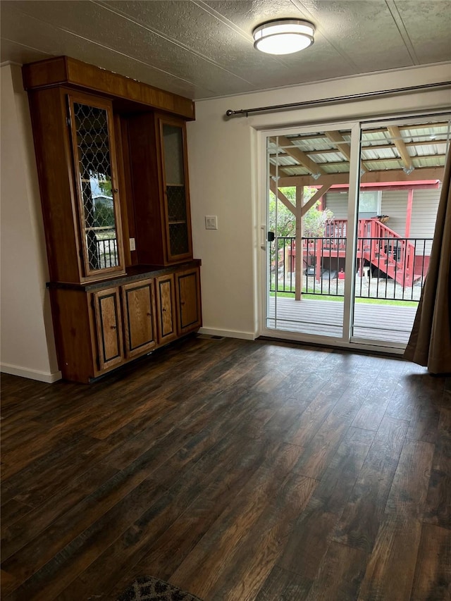 467 Grantsdale Rd Unit 16, Hamilton, MT 59840 - unfurnished room featuring baseboards and dark wood-style flooring