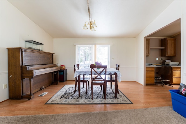 1709 20th Ave S, Great Falls, MT 59405 - dining room featuring a chandelier, light wood-type flooring, a desk, and washer / clothes dryer
