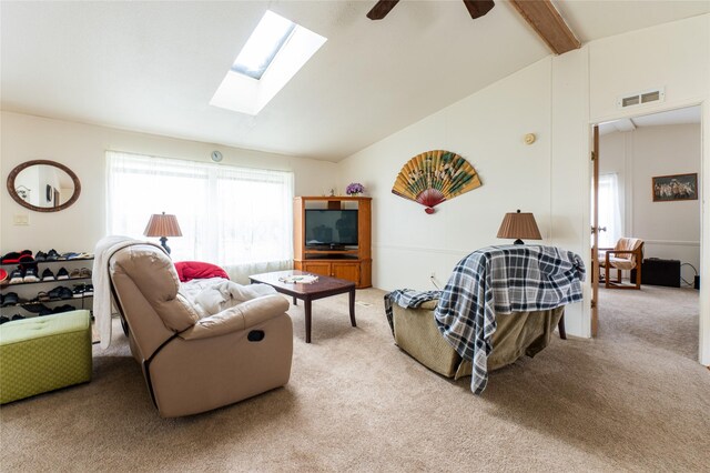 1709 20th Ave S, Great Falls, MT 59405 - living room with light carpet, a skylight, and a ceiling fan