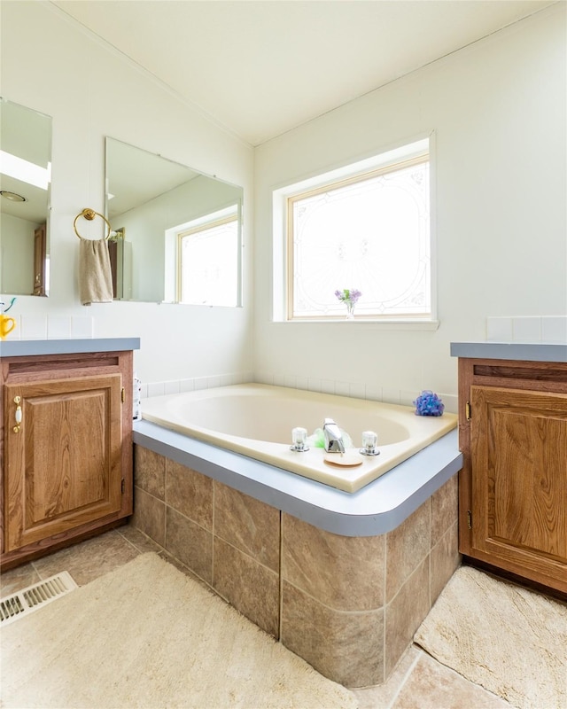 1709 20th Ave S, Great Falls, MT 59405 - full bathroom featuring vanity, tile patterned flooring, and a garden tub