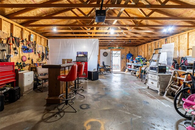 1709 20th Ave S, Great Falls, MT 59405 - garage with a garage door opener and a workshop area