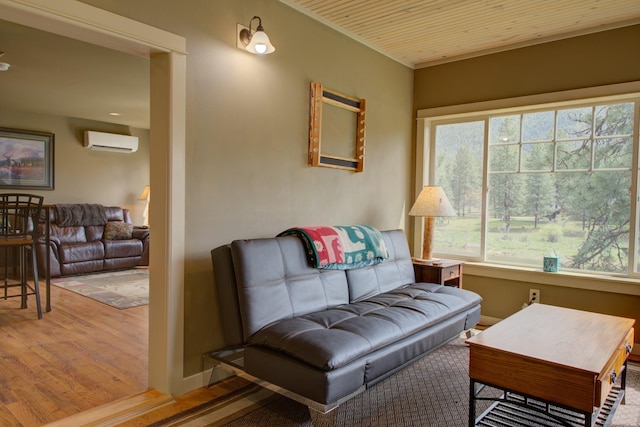 2055 Diamond Match Rd, Superior, MT 59872 - sitting room with a wall mounted air conditioner, wood finished floors, and wood ceiling