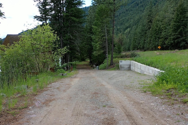 2055 Diamond Match Rd, Superior, MT 59872 - view of dirt / gravel road featuring a wooded view