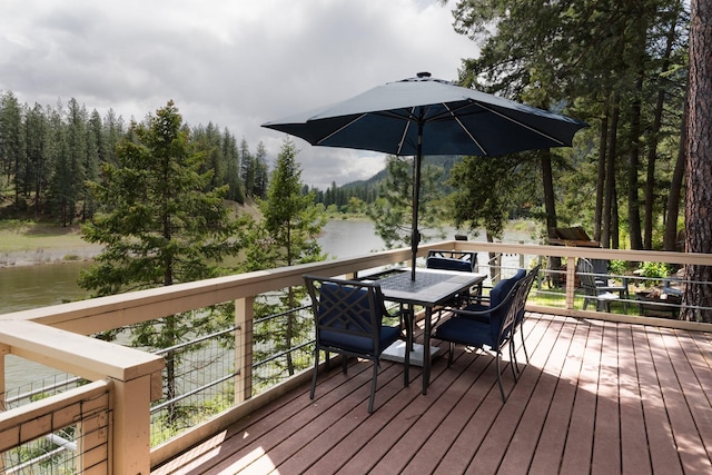 2055 Diamond Match Rd, Superior, MT 59872 - wooden terrace with a water view, outdoor dining space, and a forest view