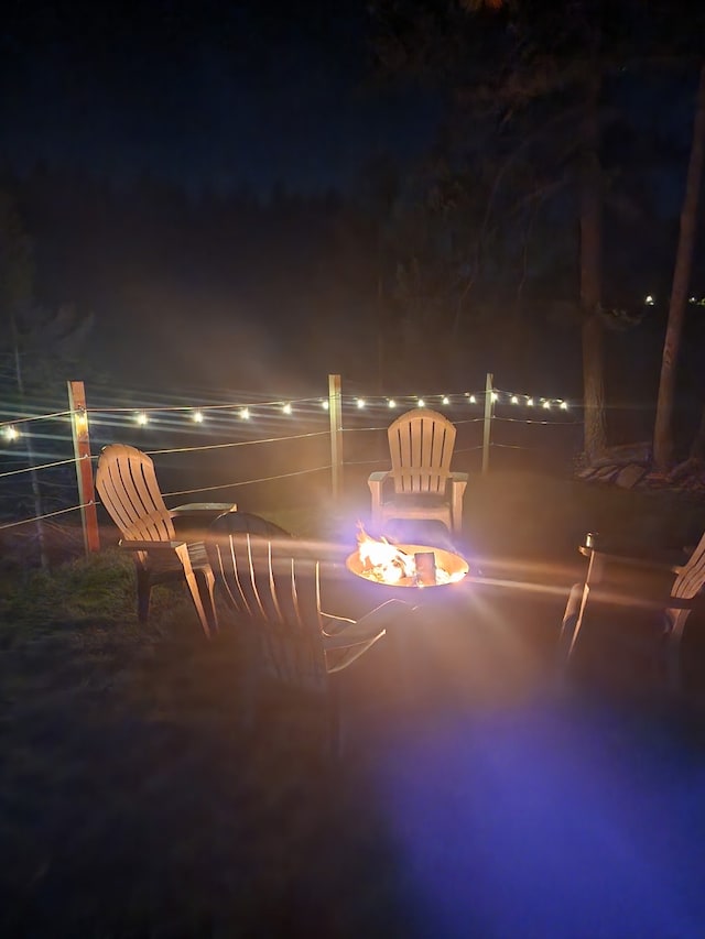 2055 Diamond Match Rd, Superior, MT 59872 - patio at twilight with a fire pit