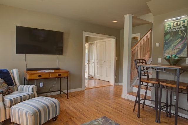 2055 Diamond Match Rd, Superior, MT 59872 - living room with stairs, wood finished floors, baseboards, and recessed lighting