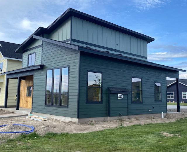 619 Holstein Way, Kalispell, MT 59901 - rear view of house with a yard