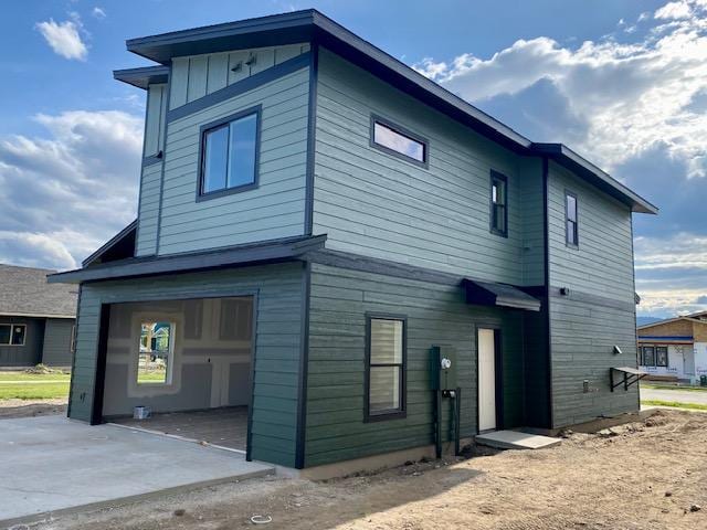619 Holstein Way, Kalispell, MT 59901 - rear view of property with a garage and concrete driveway