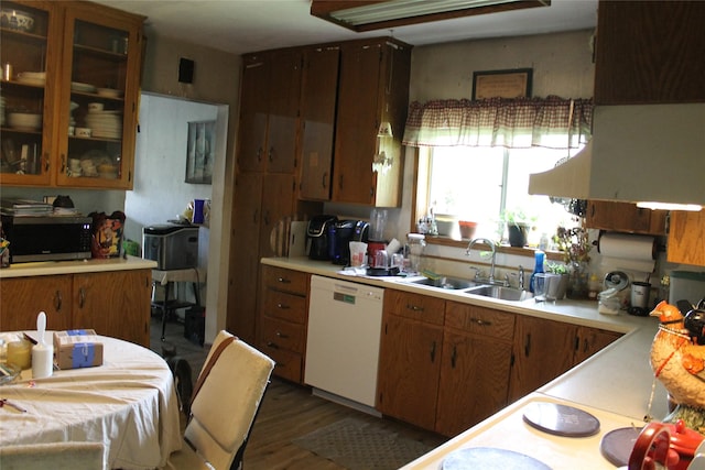 303 Swamp Creek Loop Rd, Trout Creek, MT 59874 - kitchen with dishwasher, stainless steel microwave, a sink, light countertops, and dark wood-style floors