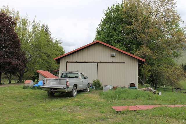 303 Swamp Creek Loop Rd, Trout Creek, MT 59874 - view of property exterior with an outbuilding, a lawn, and a detached garage