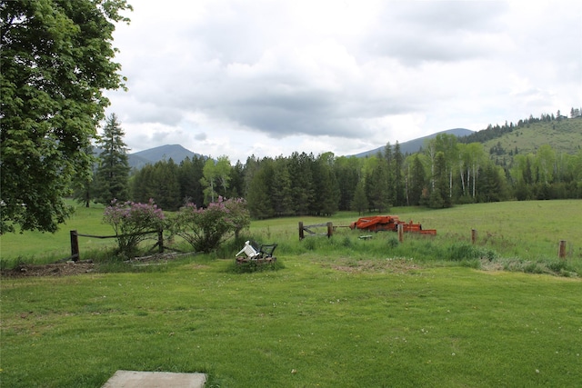 303 Swamp Creek Loop Rd, Trout Creek, MT 59874 - view of green lawn featuring a mountain view and a rural view