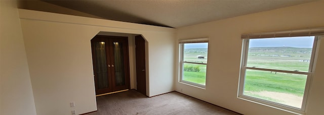 8 Teresa Ln, Great Falls, MT 59404 - spare room with light colored carpet, lofted ceiling, and arched walkways