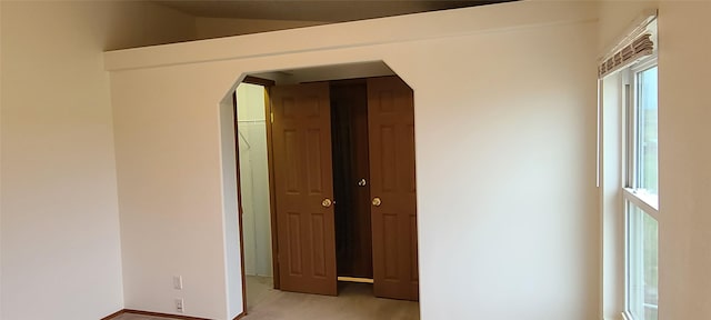 8 Teresa Ln, Great Falls, MT 59404 - spare room with arched walkways, light colored carpet, and healthy amount of natural light