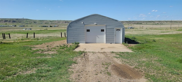 8 Teresa Ln, Great Falls, MT 59404 - view of outdoor structure featuring driveway and a view of countryside