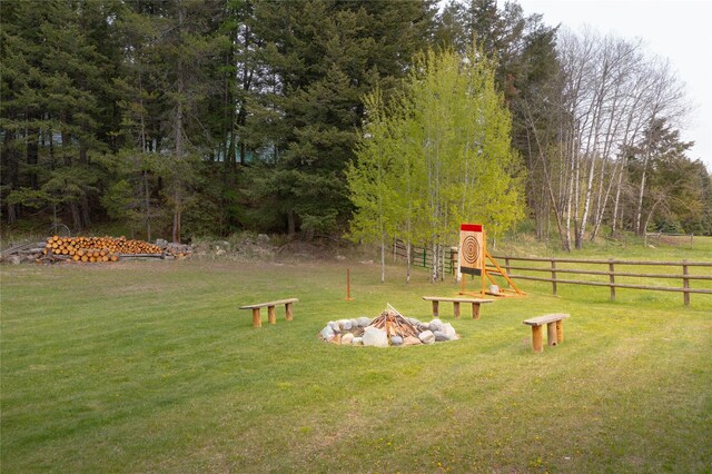 12520 Pinkham Creek Rd, Rexford, MT 59930 - view of yard featuring an outdoor fire pit and a wooded view
