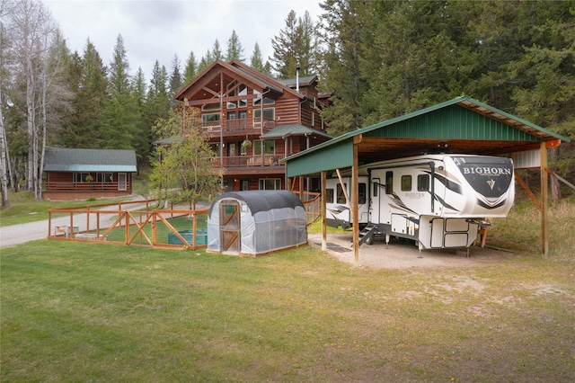 12520 Pinkham Creek Rd, Rexford, MT 59930 - back of property with a lawn and a carport