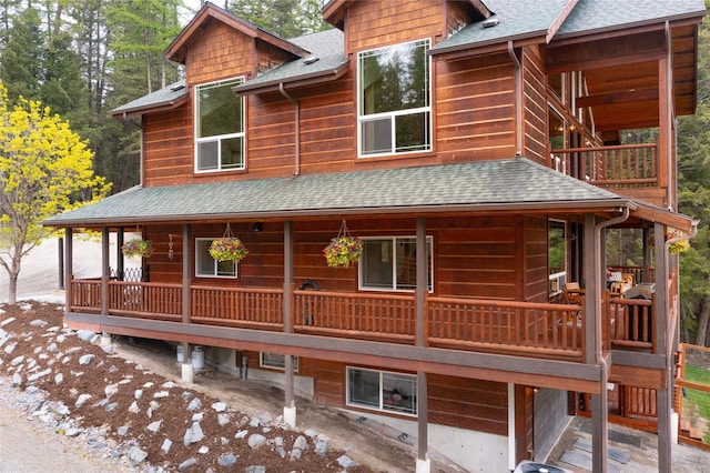 12520 Pinkham Creek Rd, Rexford, MT 59930 - view of front of property featuring a shingled roof and a balcony