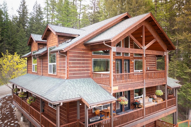12520 Pinkham Creek Rd, Rexford, MT 59930 - rear view of house featuring a shingled roof, a balcony, and a deck