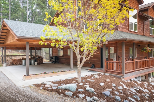 12520 Pinkham Creek Rd, Rexford, MT 59930 - view of front of house featuring roof with shingles and covered porch