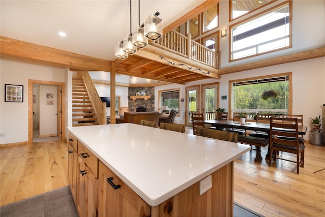 12520 Pinkham Creek Rd, Rexford, MT 59930 - kitchen with light wood-type flooring, a kitchen island, light countertops, recessed lighting, and baseboards