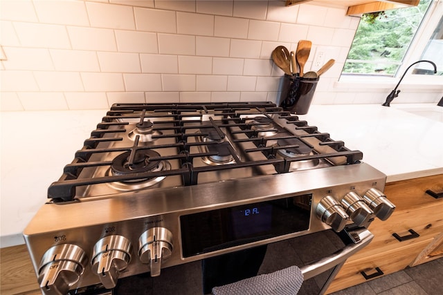 12520 Pinkham Creek Rd, Rexford, MT 59930 - kitchen view of gas stove and decorative backsplash