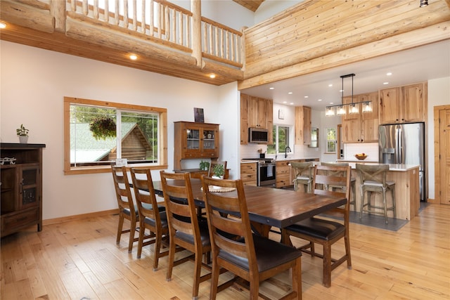 12520 Pinkham Creek Rd, Rexford, MT 59930 - dining space with a high ceiling, plenty of natural light, light wood-type flooring, baseboards, and recessed lighting