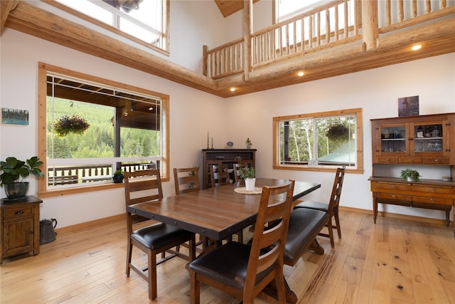 12520 Pinkham Creek Rd, Rexford, MT 59930 - dining area with a towering ceiling, baseboards, and light wood-style floors