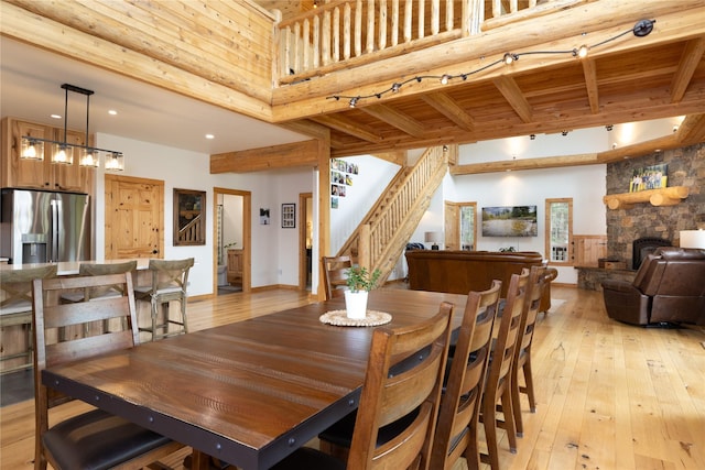 12520 Pinkham Creek Rd, Rexford, MT 59930 - dining area featuring light wood-style flooring, beamed ceiling, stairs, and recessed lighting
