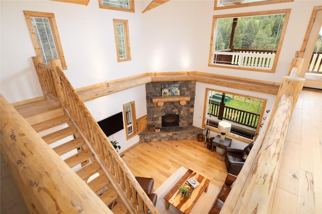 12520 Pinkham Creek Rd, Rexford, MT 59930 - living area featuring wood finished floors, stairway, and a fireplace
