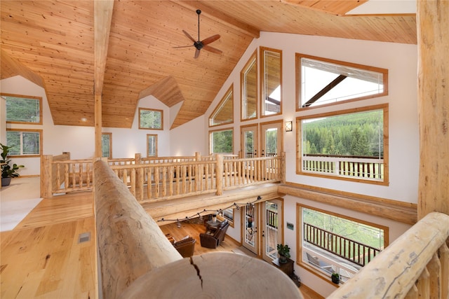 12520 Pinkham Creek Rd, Rexford, MT 59930 - staircase with wood ceiling with exposed beams, high vaulted ceiling, wood finished floors, plenty of natural light, and ceiling fan
