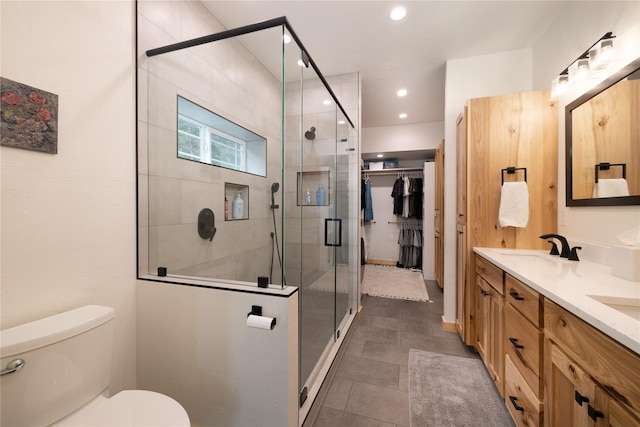 12520 Pinkham Creek Rd, Rexford, MT 59930 - bathroom featuring double vanity, a shower stall, toilet, and recessed lighting