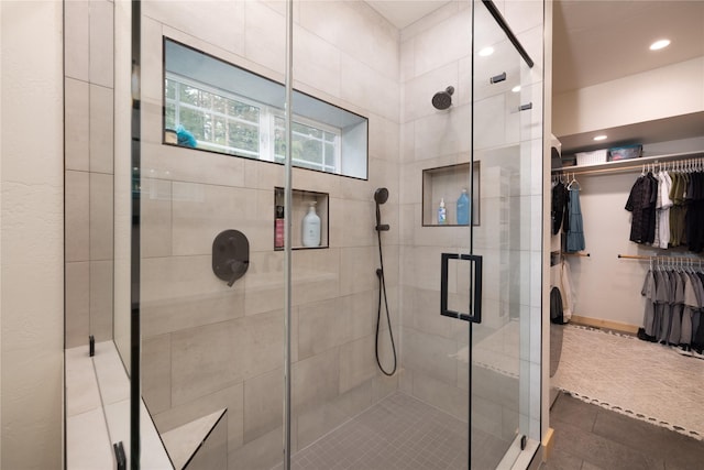 12520 Pinkham Creek Rd, Rexford, MT 59930 - full bathroom featuring a shower stall, a walk in closet, recessed lighting, and tile patterned flooring