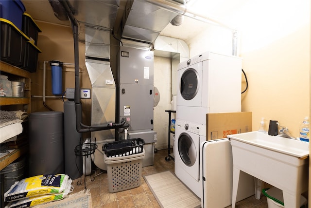 12520 Pinkham Creek Rd, Rexford, MT 59930 - washroom with stacked washer / dryer and stone finish flooring