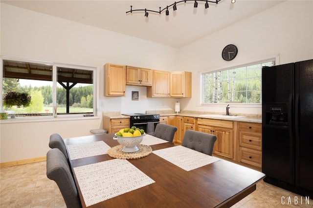 12520 Pinkham Creek Rd, Rexford, MT 59930 - kitchen featuring black appliances, a sink, light brown cabinets, and light countertops